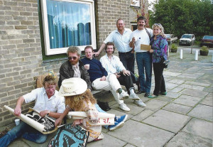 Richard Keyes ( L holding poster) and Margaret Bolderson in cowboy hat. On the bench (L) Pete Tidball,  Dave Farnsworth (former English Language tutor) Alan Swift. Standing Andy Rashleigh, Liam Arthurs and Sue Bachelor.